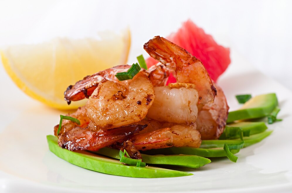Experience the simplicity and elegance of Grilled Royal Red Shrimp drizzled with a zesty lemon-garlic butter sauce. This dish highlights the shrimp's natural sweetness while adding a tangy kick.